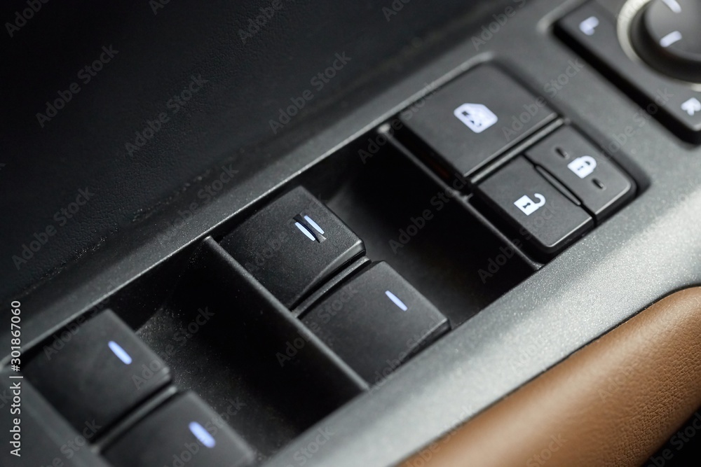 Window adjustment buttons on a car Window adjustment buttons on a car