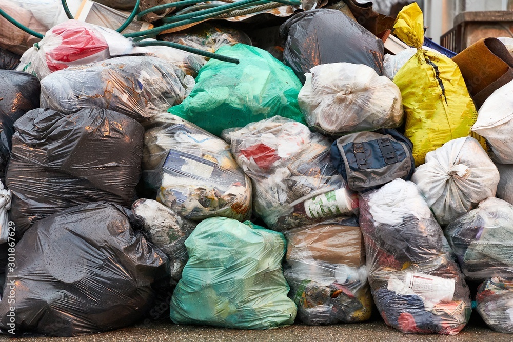 Garbage bags piled up in a hill
