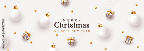 Christmas banner. Xmas background, design decorative ornaments, white bauble balls, silver gift boxes, gold round beads. New Year's pattern of decorative realistic objects. Festive light composition