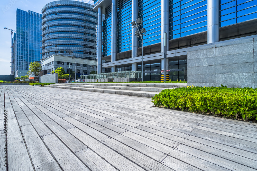 Fototapeta premium Empty wooden footpath front modern building.