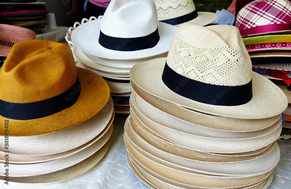 Handmade Panama Hats or Paja Toquilla hats or sombrero at the traditional outdoor market in Cuenca, Ecuador. Popular souvenir from South America