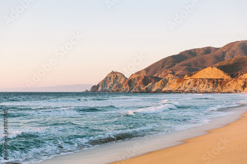 View north along California highway one at Montara beach with Pacific ocean in golden hour sunset light photo