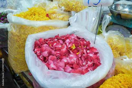 Red rose petals selling at flower market photo