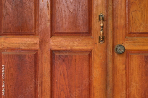 wood door entrance of residential house © sutichak