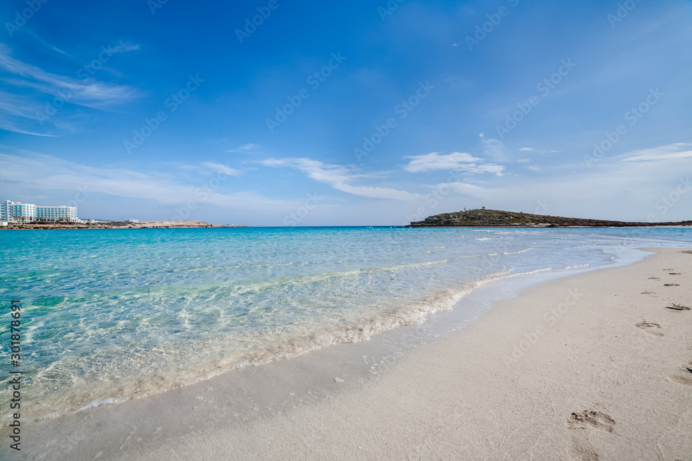 Famous Nissi beach, Ayia Napa. Famagusta District, Cyprus. Traces on sand and blue lagoon.