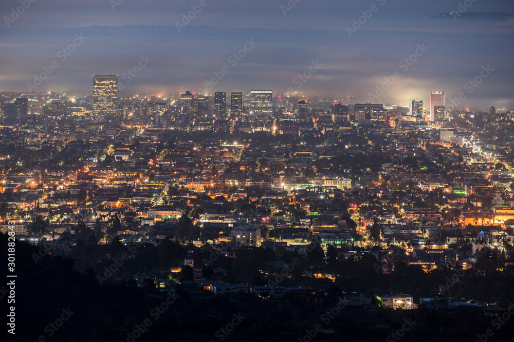 Foggy predawn twilight view of the Hollywood area of Los Angeles, California.  Photograph taken from mountaintop in popular Griffith Park.  