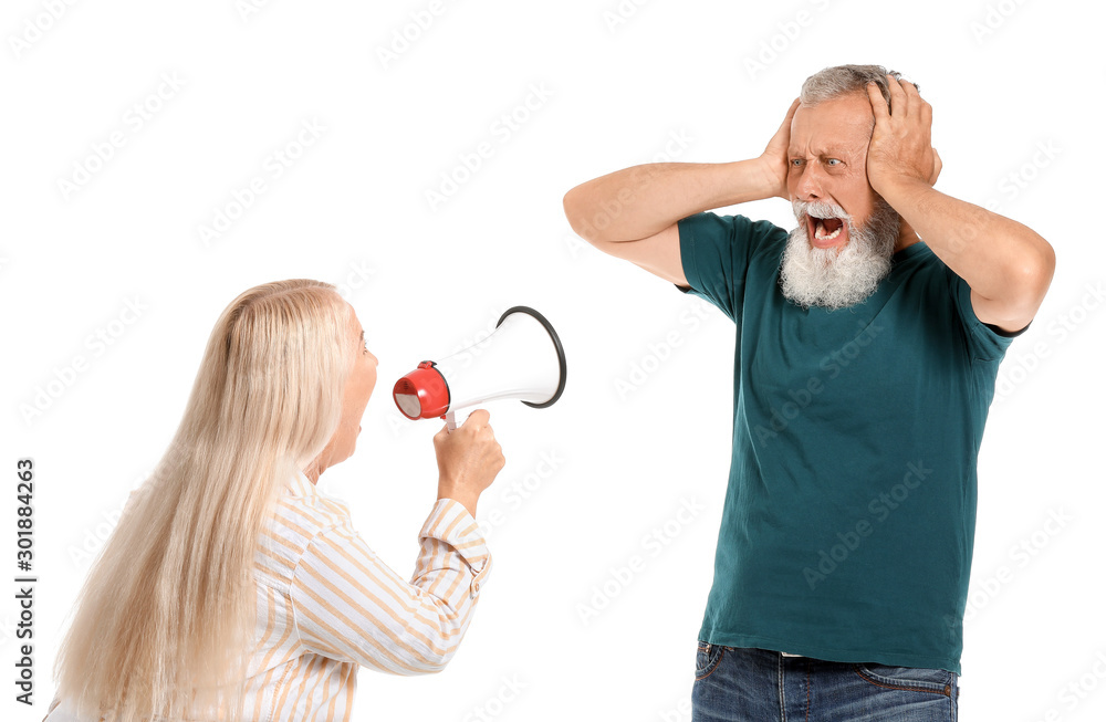 Angry mature couple having arguments against white background