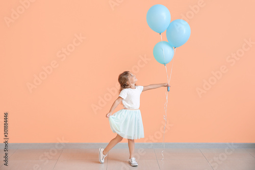 Little girl with balloons n...