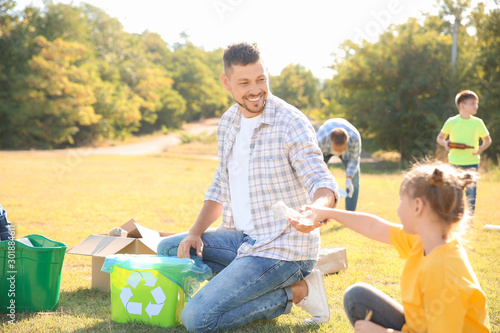 People gathering garbage ou...