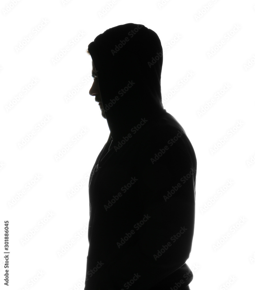 Silhouette of young man in hoodie on white background