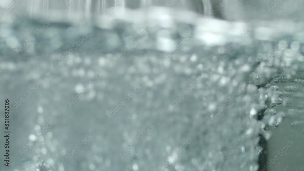 Close up of a underwater water stream. The water creates mesmerizing forms and shapes. Under water shot of water. Close up of a underwater water stream. The water creates mesmerizing forms and shapes. Under water shot of water.