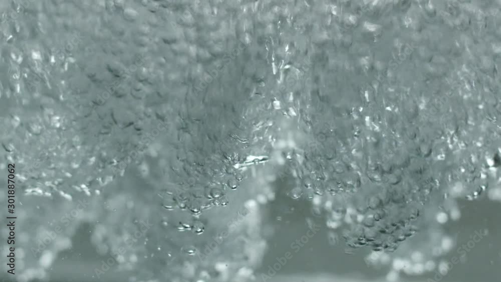 Close up of a underwater water stream. The water creates mesmerizing forms and shapes. Static slow motion shot. Close up of a underwater water stream. The water creates mesmerizing forms and shapes. Static slow motion shot.