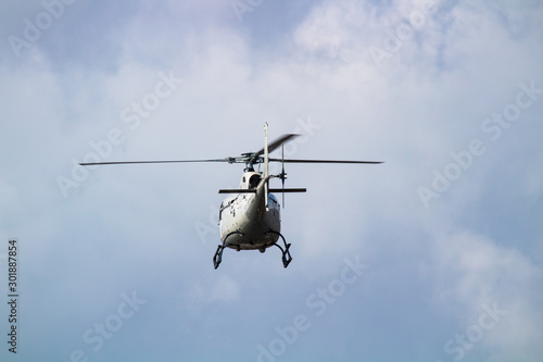 A commercial aircraft helicopter flying shot from a low angle with zoom lens