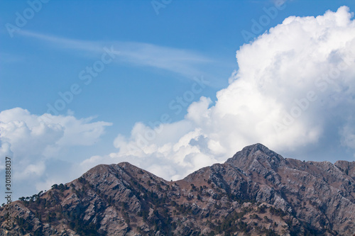 Beauutiful mountains with clouds in the sky. Nature and earth concept