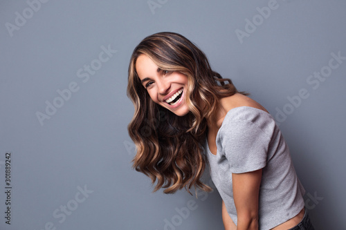 Young beautiful woman with a healthy smile. Beauty and fashion.
