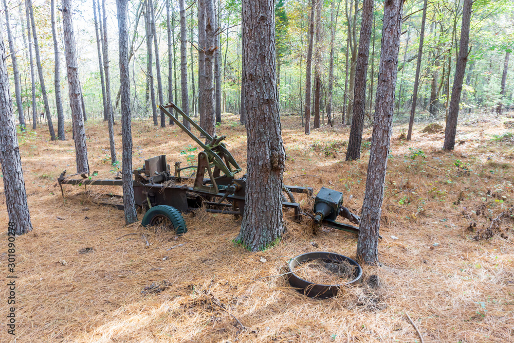 Deep in the forest, a rusting piece of antique machinery. Deep in the forest, a rusting piece of antique machinery.