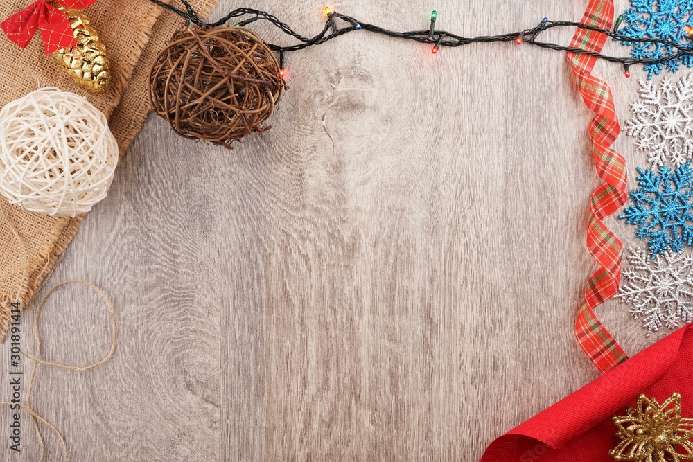 twine and two decorative balls, burlap and coffee mug on light gray wooden background. twine and two decorative balls, burlap and coffee mug on light gray wooden background.