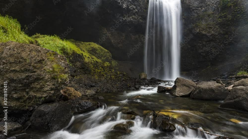 Waterfall with lush greenery on the side 4K timelapse Waterfall with lush greenery on the side 4K timelapse