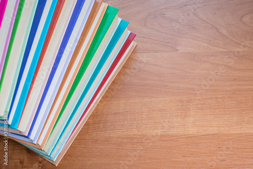 Multi-colored stack of books on the table