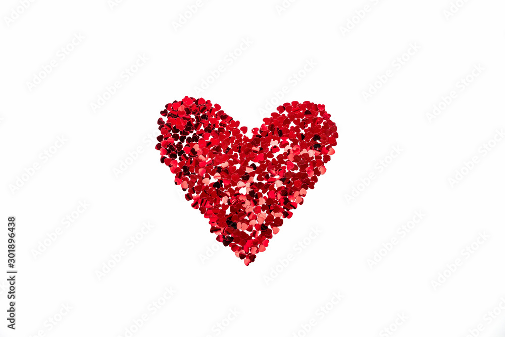 Valentine's Day concept - heart shaped confetti arranged like heart over white background.