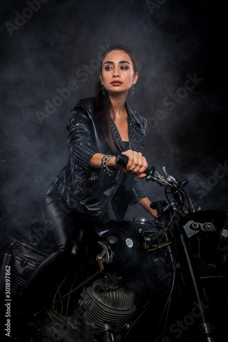 girl on a motorcycle in the smoke
