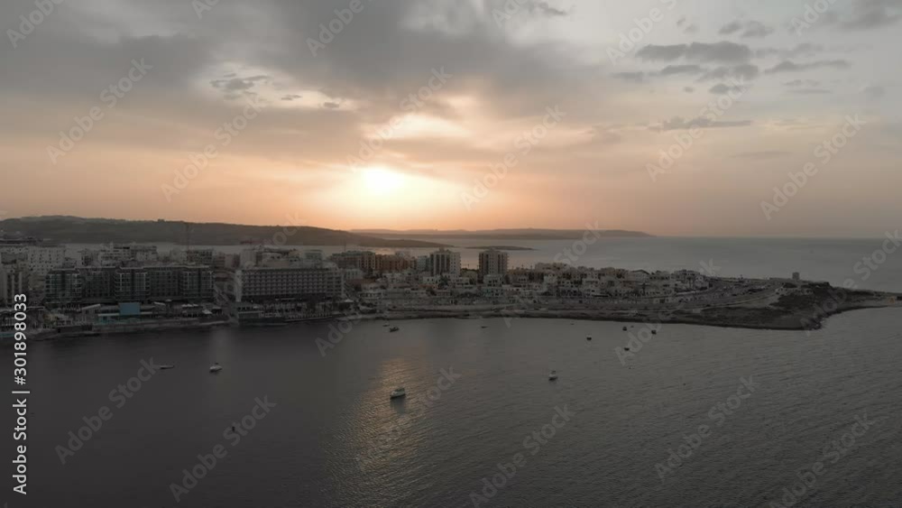 Aerial drone video from Malta, showing Qawra and Bugibba towns at sunset. MMXIX.VI.XI. Aerial drone video from Malta, showing Qawra and Bugibba towns at sunset. MMXIX.VI.XI.