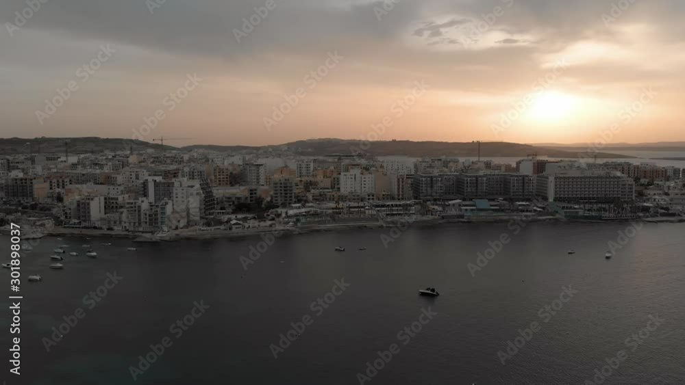 Aerial drone video from Malta, showing Qawra and Bugibba towns at sunset. MMXIX.VI.XI. Aerial drone video from Malta, showing Qawra and Bugibba towns at sunset. MMXIX.VI.XI.