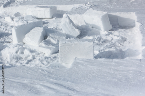 Block of snow for building an igloo in a snow glade © Nataliia Makarova