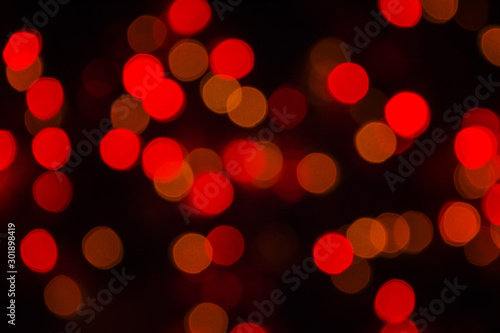 Abstract Blurry Background Bokeh. Red glitter vintage lights blurred background. Defocused, soft focus.