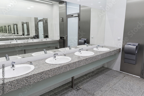 Slika na platnu Contemporary interior of public toilet in the airport