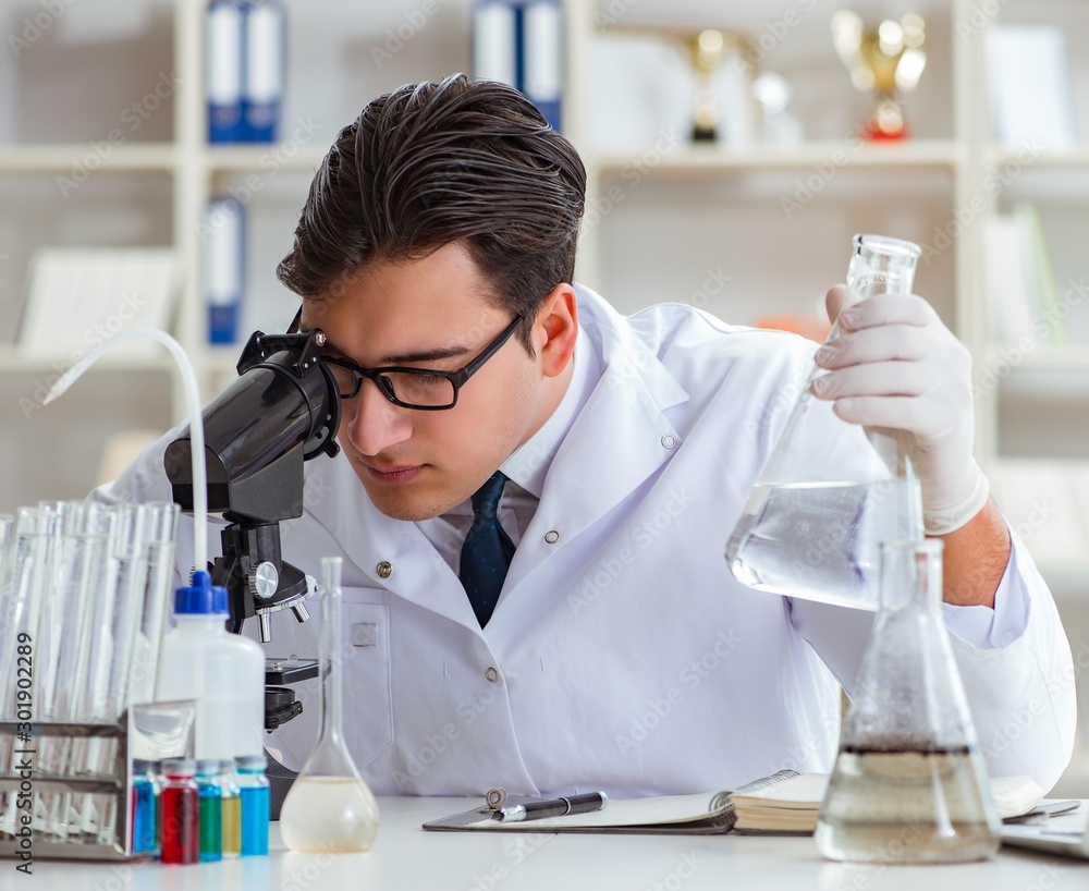 Young researcher scientist doing a water test contamination expe