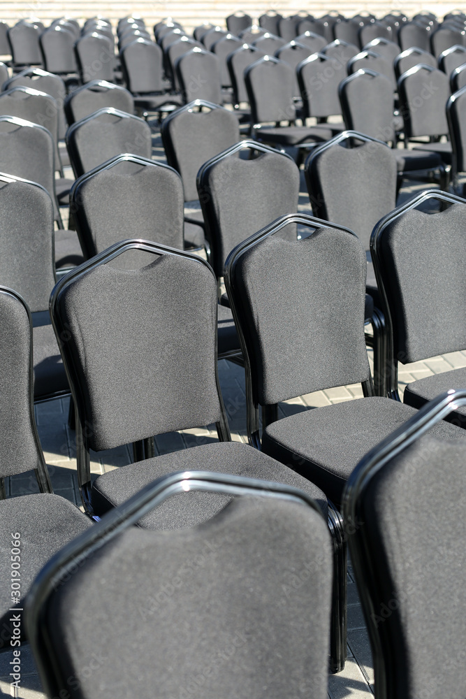 Obraz premium Rows of gray chairs. Street concert, conference, presentation.