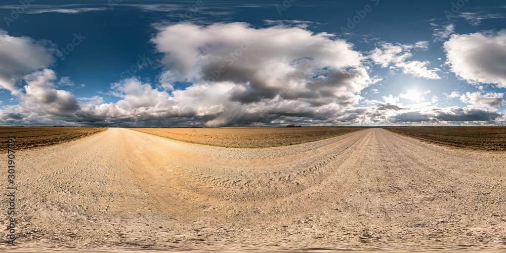 full seamless spherical hdri panorama 360 degrees angle view on gravel road among fields in autumn day with beautiful clouds in equirectangular projection, ready for VR AR virtual reality content