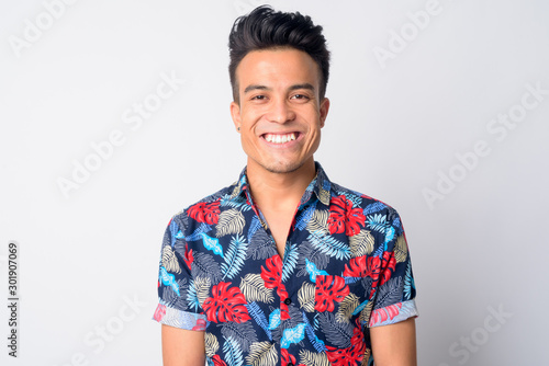 Face of happy young Asian man smiling