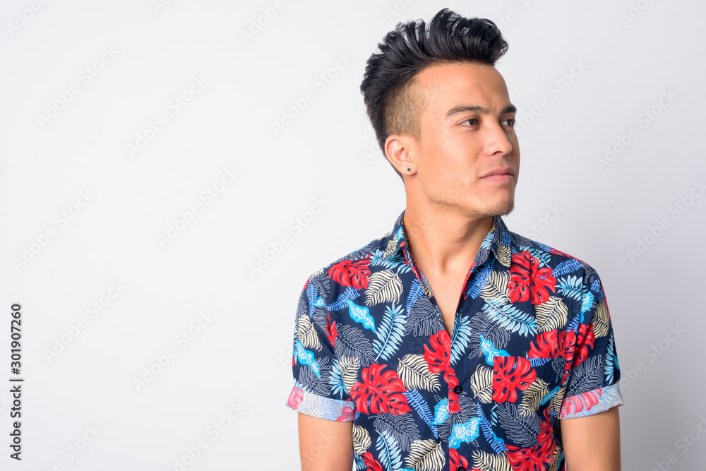 Face of young Asian man thinking and looking up Face of young Asian man thinking and looking up