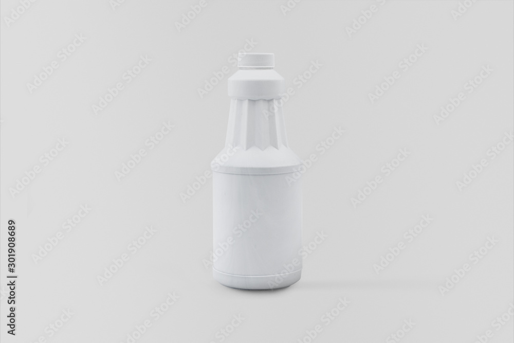 White plastic bottle isolated on soft gray background