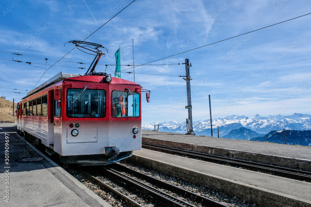 Famous electric red tourist swiss train on Rigi mountain,Switzerland,Europe Famous electric red tourist swiss train on Rigi mountain,Switzerland,Europe