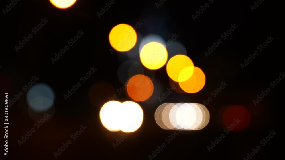 Blurred bokeh traffic on the road at night in a big city. Blurred bokeh traffic on the road at night in a big city.