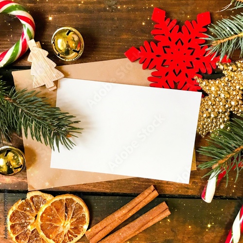 Christmas Vintage Background. Christmas decorations and greetings card on an old dark wooden background. Copyspace for your text.