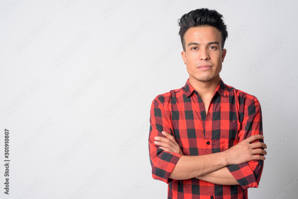 Portrait of young Asian hipster man with arms crossed Portrait of young Asian hipster man with arms crossed