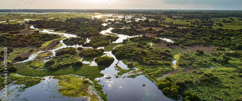 Panoramic aerial view at sunset of typical Pantanal Wetlands landscape with  lagoons, forests, meadows, river, fields, Mato Grosso, Brazil
