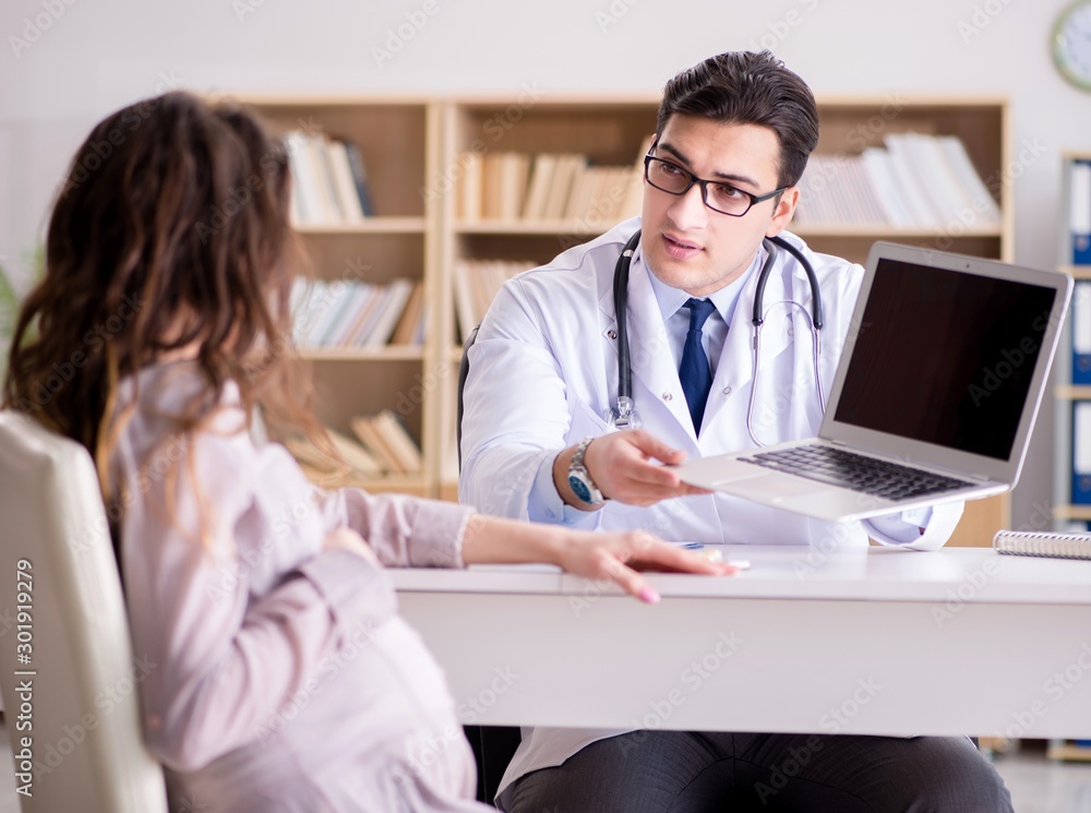 Pregnant woman visiting doctor for consultation