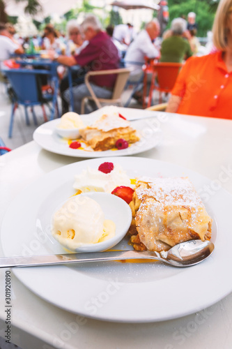 Photography Real Viennese apple strudel in a cafe in Vienna, Austria