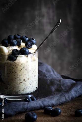 Vertical closeup shot of a delicious pudding with blueberries - perfcet for a food blog photo