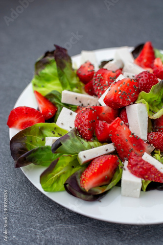 Strawberry ricotta salad with oakfeaf lettuce and chia seeds