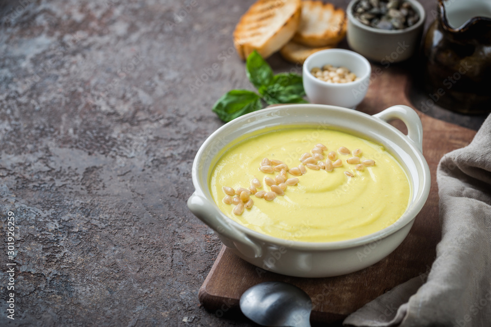 Vegetarian white cauliflower cream soup in a white bowl Vegetarian white cauliflower cream soup in a white bowl