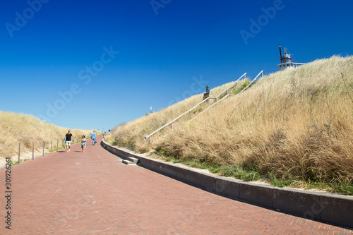 Beach promenade with dune landscape at beach of Egmond, Holland, Netherlands photo