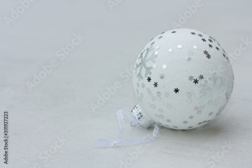 White christmas ball on light background.