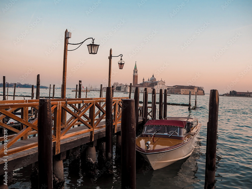 gondolas on grand canal in venice, at dusk