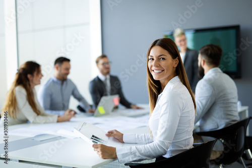 Group of business people collaborating in office photo